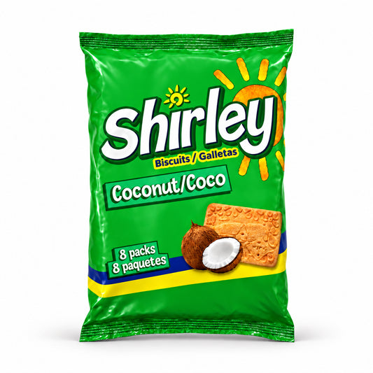 A green bag of Wibisco Shirley Biscuits Coconut/Coco, featuring the brand name 'Shirley' in large white letters, a coconut and biscuit illustration, and '8 pack' and '8 paquetes' text, photographed on a wood-grain surface.