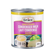 GRACE CONDENSED MILK can showcasing creamy sweetness perfect for desserts and beverages, essential for Caribbean dishes.