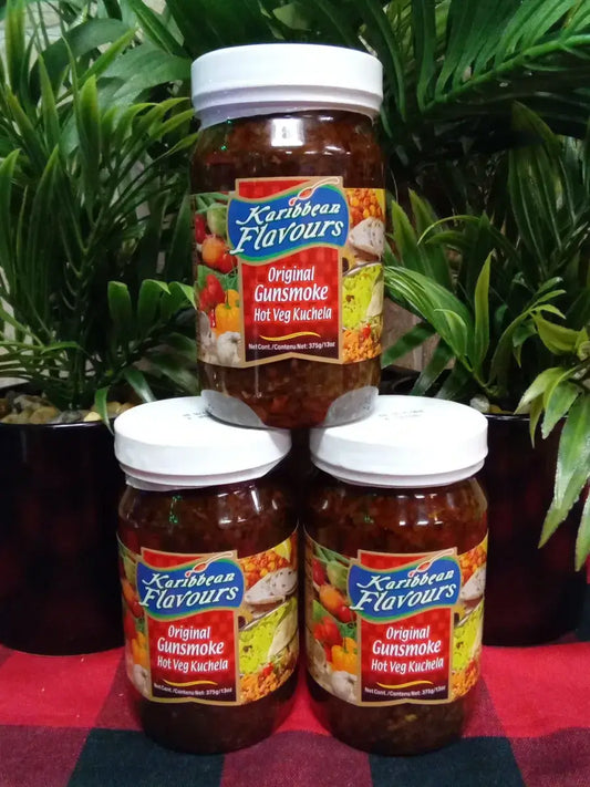 Karibbean Flavours Original Gunsmoke sauce jars in a vibrant setting, perfect for enhancing Caribbean dishes.