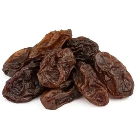 Premium raisins in a pile, showcasing their chewy texture and natural sweetness, perfect for snacking or baking.